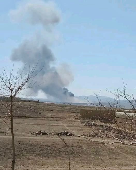 Smoke Rises from Bombed Base